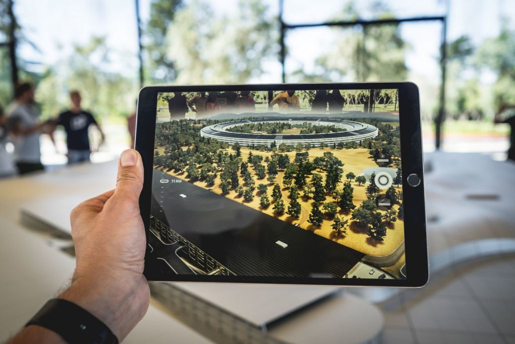 Image Films and augmented reality can be used together like seen here with a person holding an iPad in front of a table