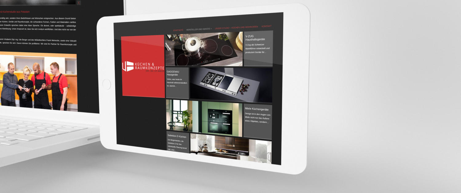 Showing the corporate design of a website on a stylized white iPad with a white notebook in the background