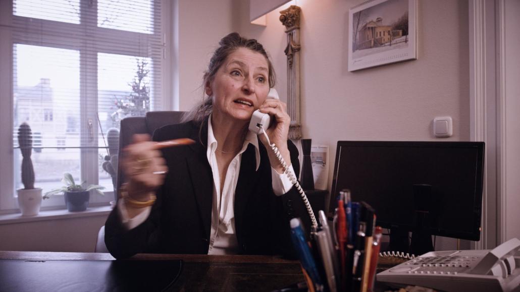 Movie production still shows a woman on the telephone in an intense conversation